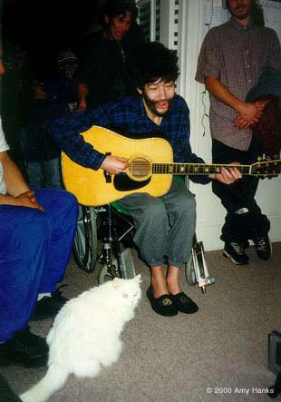 photo: Paul & his cat Lyuba at the Jan 2000 party with the Tuvans